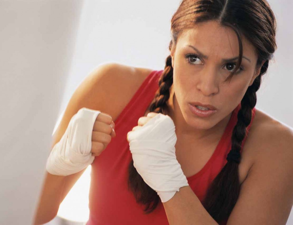 Woman Exercising with Punching Bag