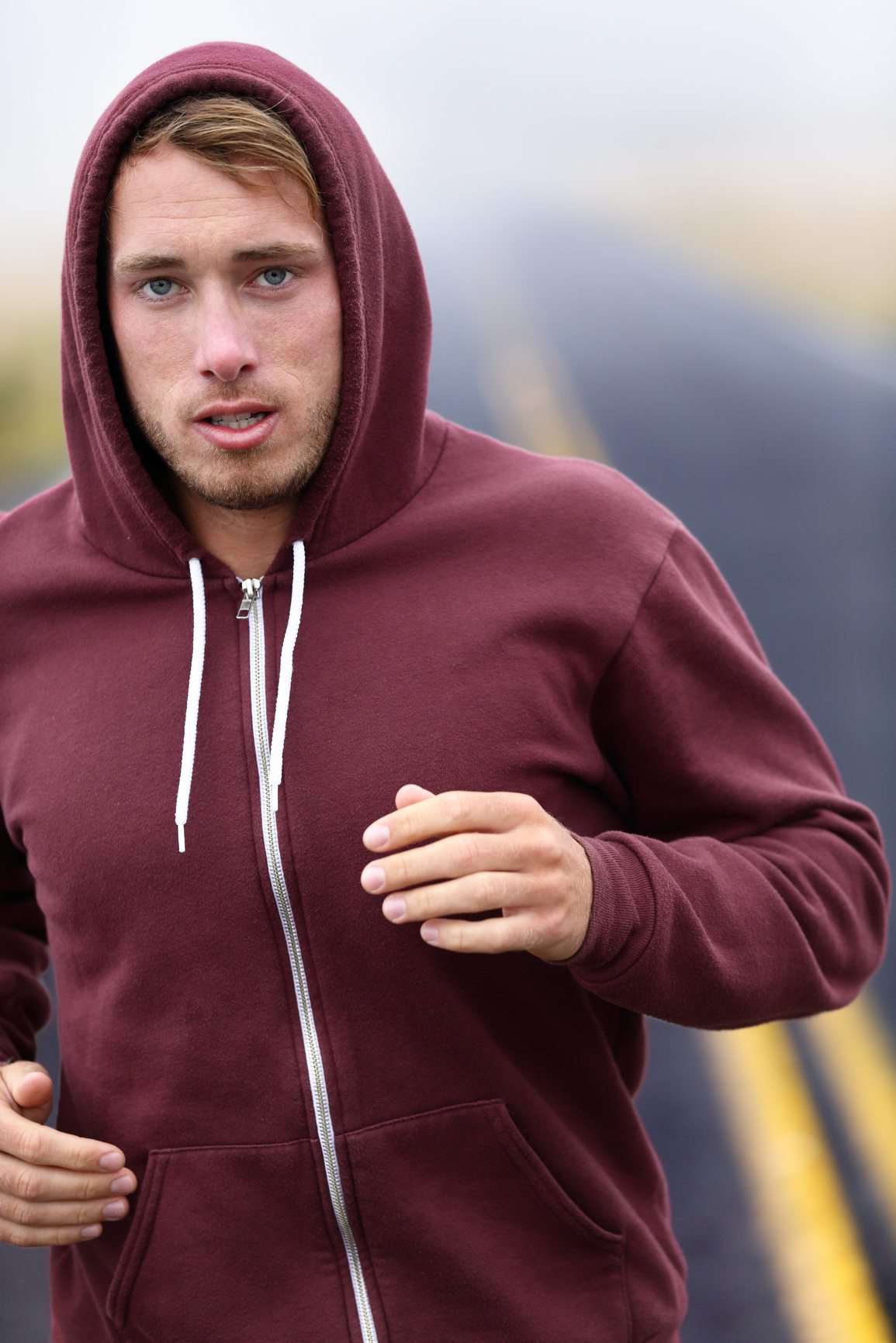 Runner athlete man running training on road